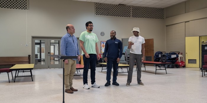 Barbershop quartet singing at rehearsal
